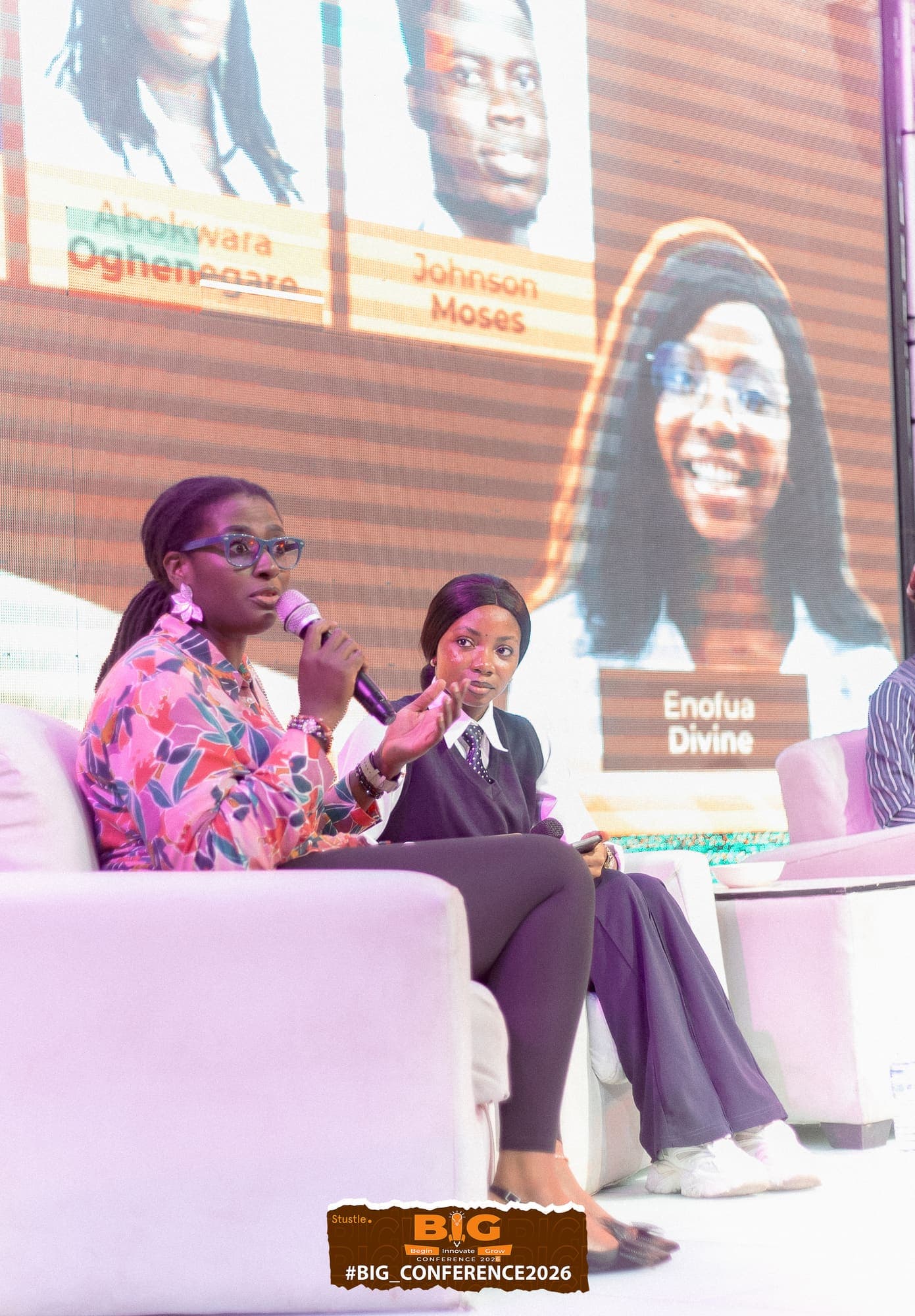 Two speakers in conversation on stage